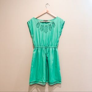 Green dress with cutouts.